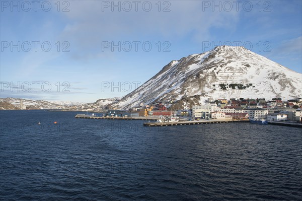 Townscape with piers and snow-covered mountain