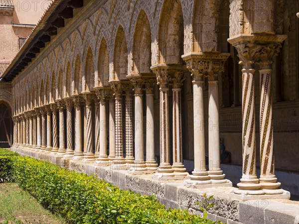 Cloister with ornate pillars at Monreale Cathedral or Cathedral Santa Maria Nuova