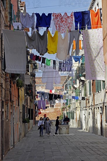 Laundry drying on laundry lines across the street