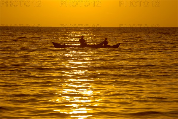 Fishermen at sunset