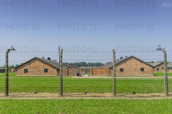 Fence surrounding residential buildings in Auschwitz-Birkenau concentration camp used by Nazis during World War II