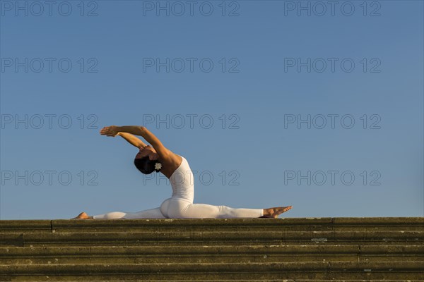 Young woman practising Hatha yoga