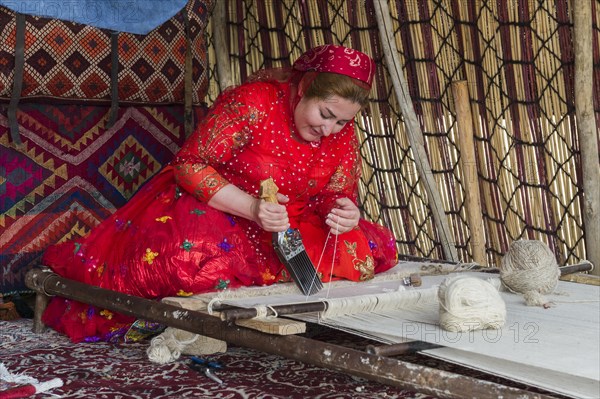 Qashqai woman weaving a carpet