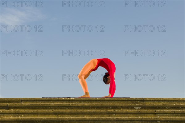 Young woman practising Hatha yoga