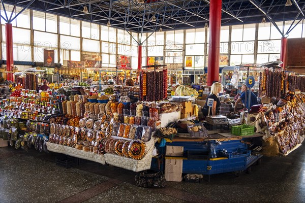 Stall in market hall with candied fruits