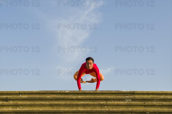 Young woman practising Hatha yoga