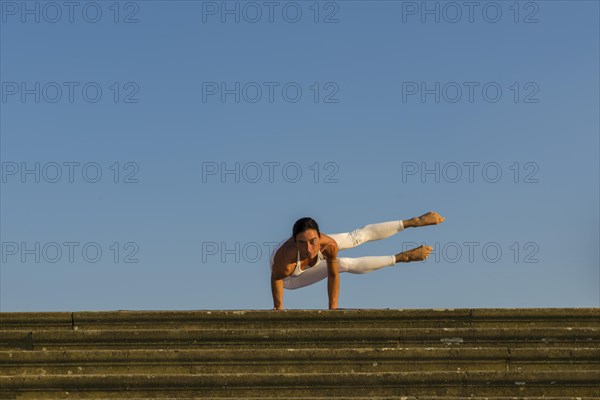 Young woman practising Hatha yoga