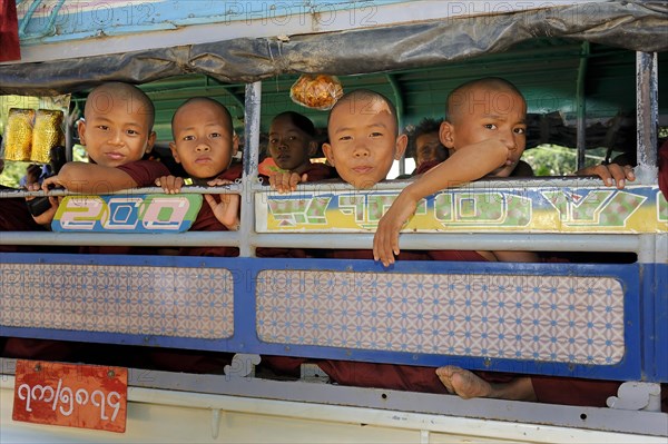 Buddhist child monks taking the school bus