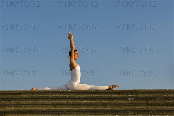 Young woman practising Hatha yoga