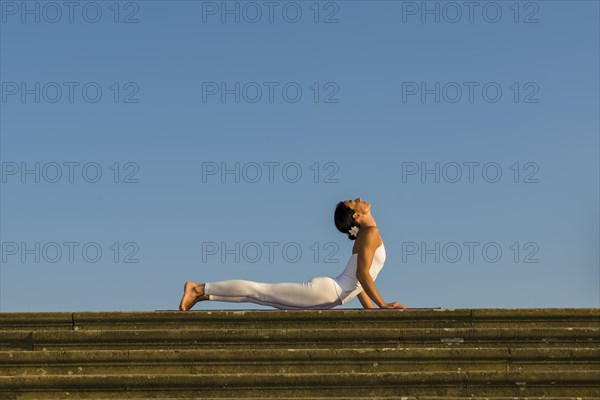 Young woman practising Hatha yoga