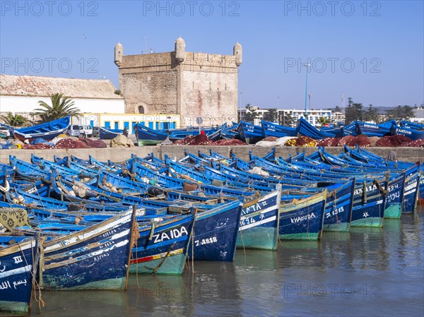 Old blue fishing boats in the port of Essaouira