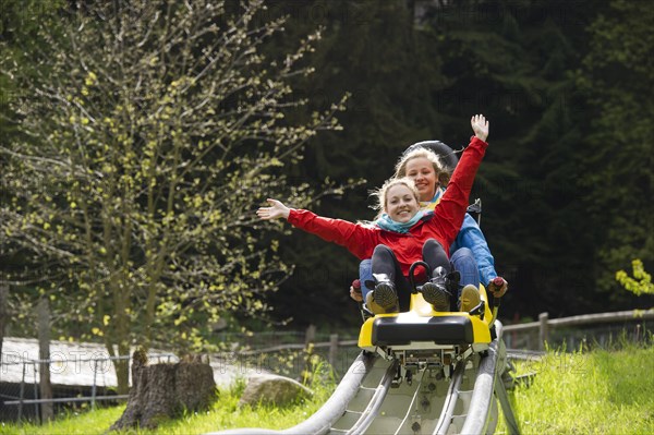 Young women on a summer toboggan run