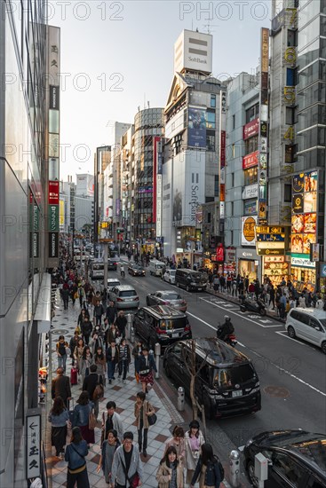 A busy street with many shopping centers and shops