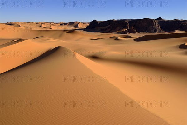 The sand dunes and rocks of Moul Naga