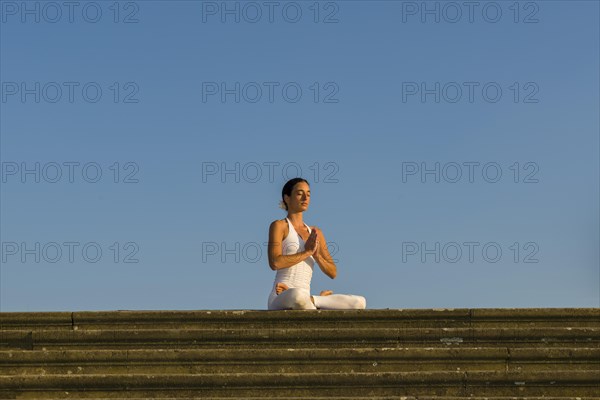 Young woman practising Hatha yoga