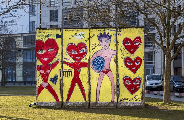 Artistically painted wall segments on the lawn at Potsdamer Platz square