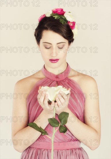 Beauty portrait of a young woman with flowers in her hair