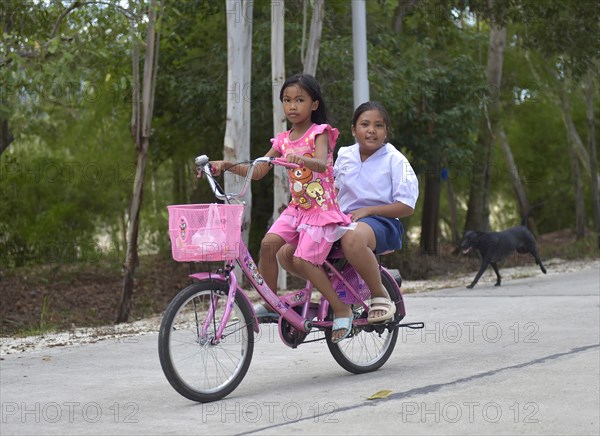 Two girls on a bike