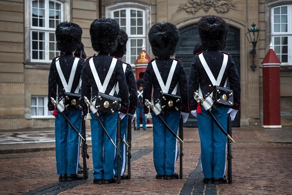 Royal Life Guards standing in snow in front of Amalienborg Palace