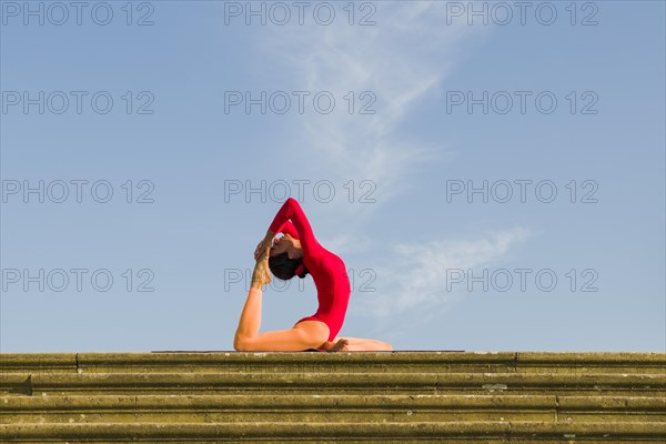 Young woman practising Hatha yoga