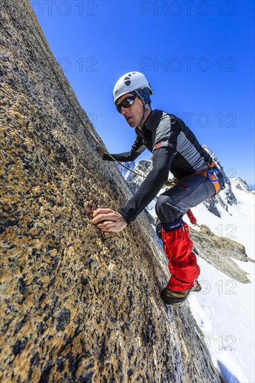 Climber climbing on a rock wall