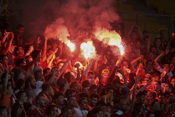 Fans of Galatasaray Istanbul cheer on their team during a friendly game against SK Rapid Vienna