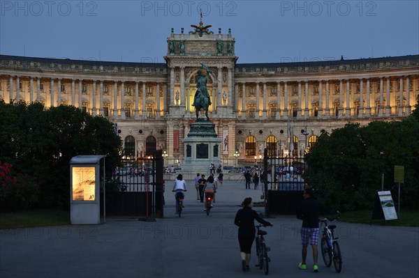 Hofburg Palace at Heldenplatz square with the equestrian monument of Archduke Charles