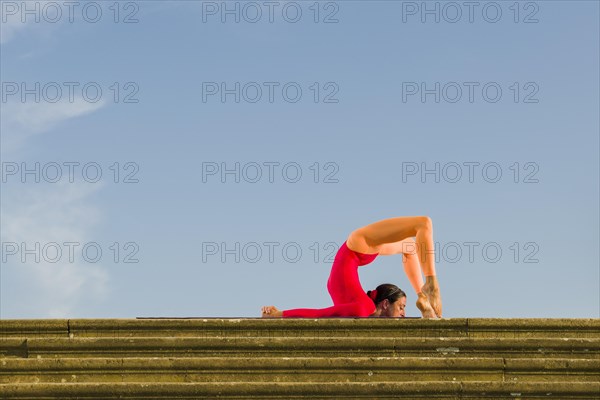 Young woman practising Hatha yoga