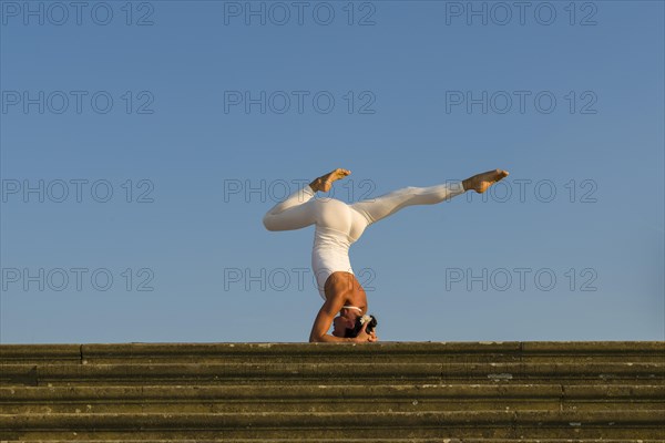 Young woman practising Hatha yoga