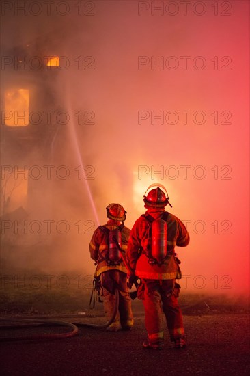 Firefighters battle a fire which destroyed a vacant home in Detroit's Morningside neighborhood