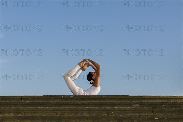 Young woman practising Hatha yoga