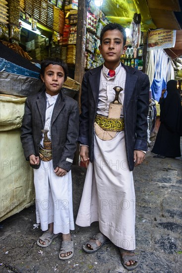 Two boys with their djambas at the spice market in the old city