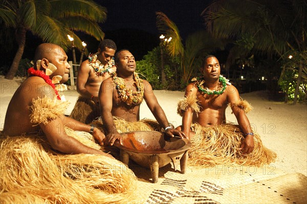 Men taking part in the Kava Ceremony