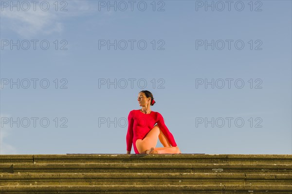 Young woman practising Hatha yoga