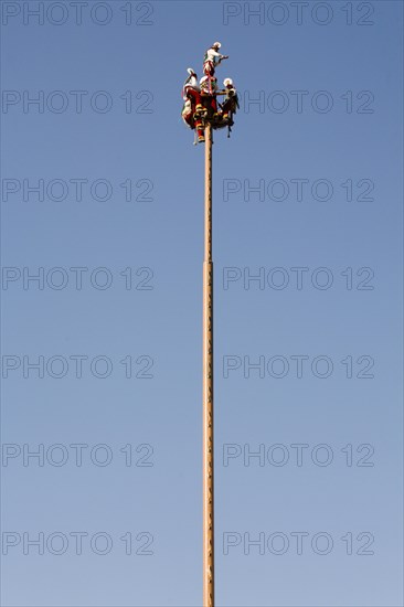 Voladores performing at a village festival