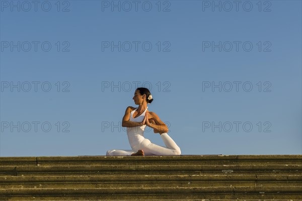 Young woman practising Hatha yoga