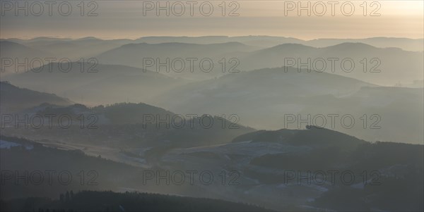 The hills of the northern Sauerland in the morning mist in Meschede