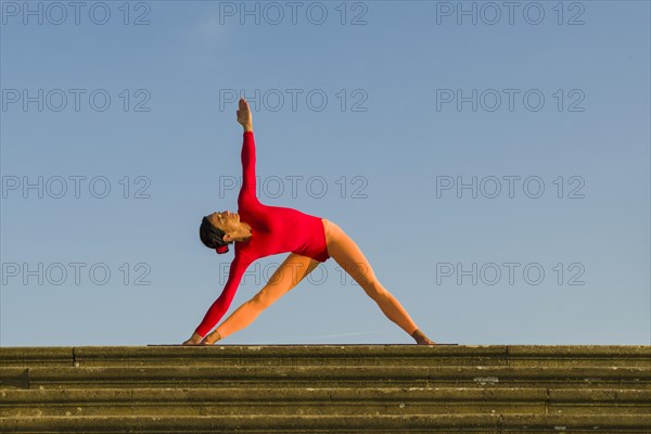 Young woman practising Hatha yoga