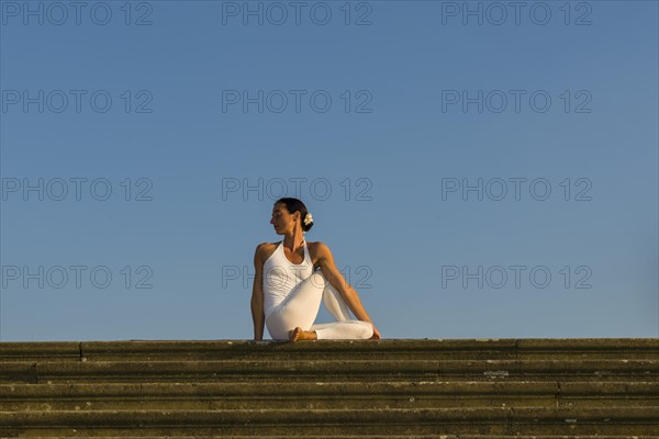 Young woman practising Hatha yoga