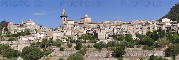 Valldemossa with the Carthusian Valldemossa Charterhouse and the parish church of Sant Bartomeu