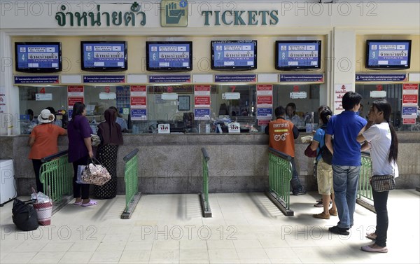 Travellers at a counter of railway station