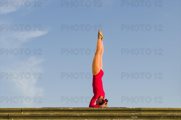 Young woman practising Hatha yoga