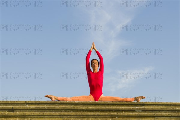 Young woman practising Hatha yoga