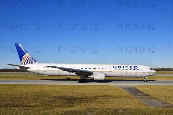 United Airlines Boeing B 767 rolling on the taxiway towards runway