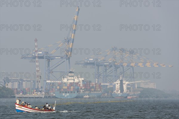Fishing boat in front of the International Container Transshipment Terminal