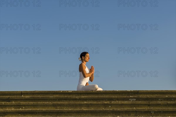 Young woman practising Hatha yoga