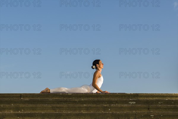 Young woman practising Hatha yoga