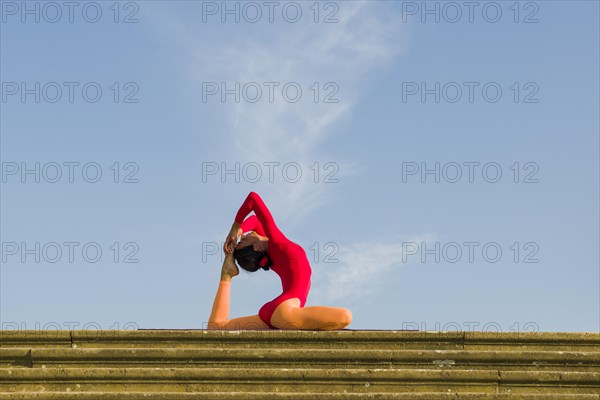 Young woman practising Hatha yoga