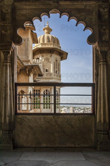 Looking out a window at the city palace of the Maharaja
