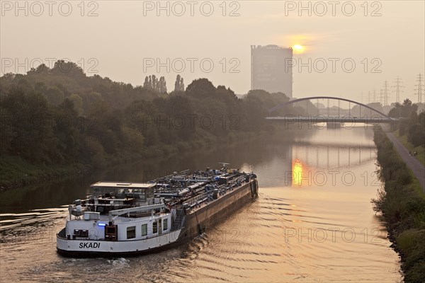 Cargo ship on the Rhine-Herne Canal with Gasometer